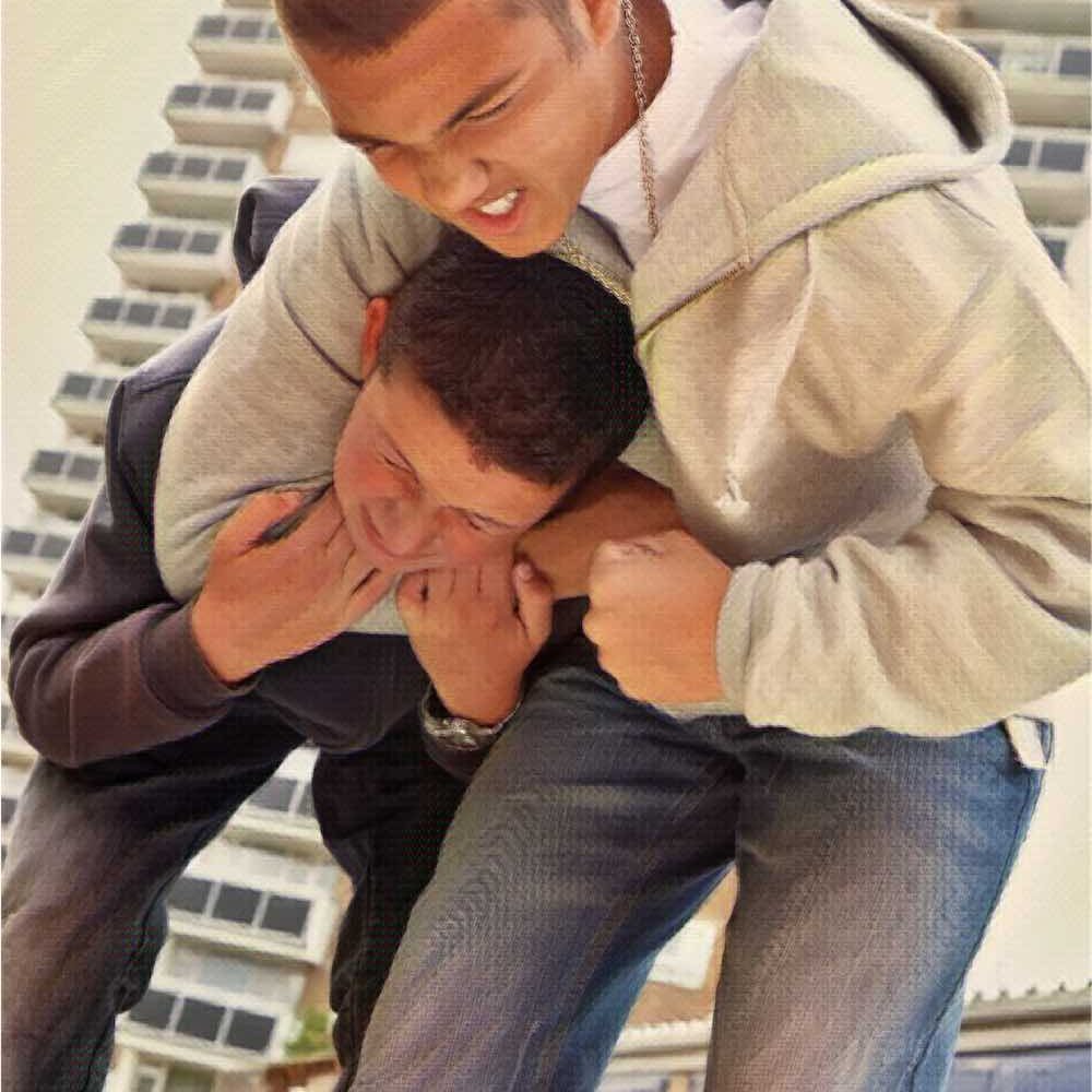 two teenage boys fighting